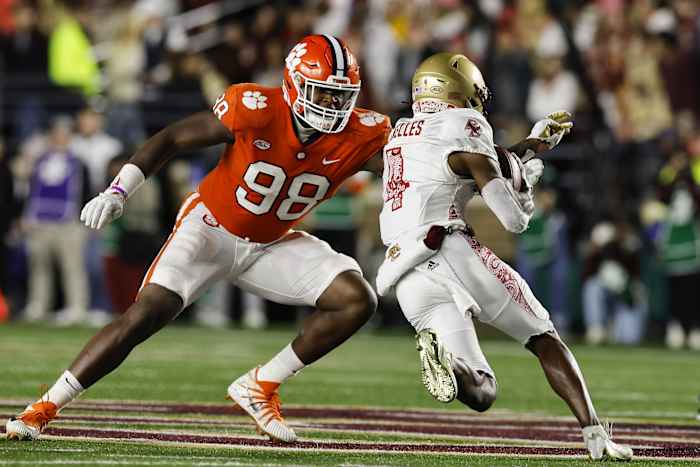 Oct 8, 2022; Chestnut Hill, Massachusetts, USA; Clemson Tigers defensive end Myles Murphy (98) moves to bring down Boston College Eagles wide receiver Zay Flowers (4) during the second half at Alumni Stadium. Mandatory Credit: Winslow Townson-USA TODAY Sports